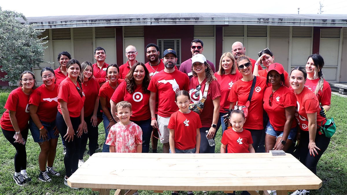 Group photo all smiling while Target helps with beautification of a school