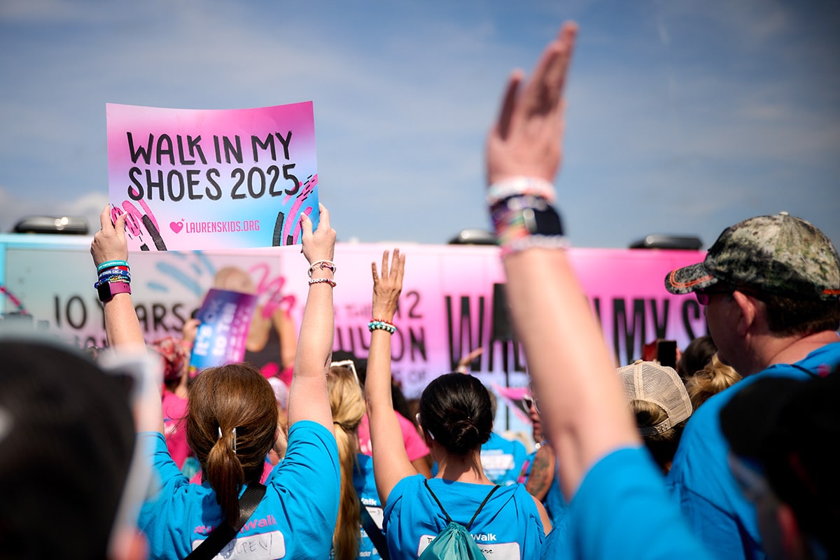 People holding signs for the walk
